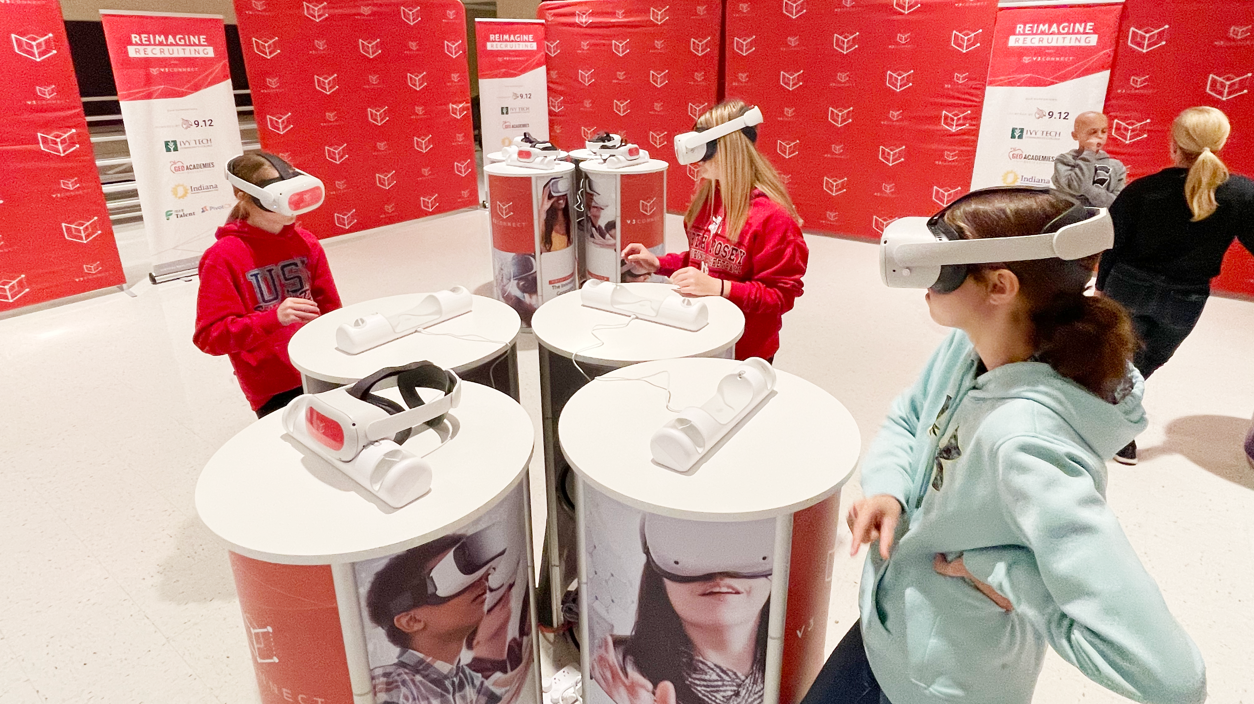 Young girls in Virtual Reality Career Exploration Headsets