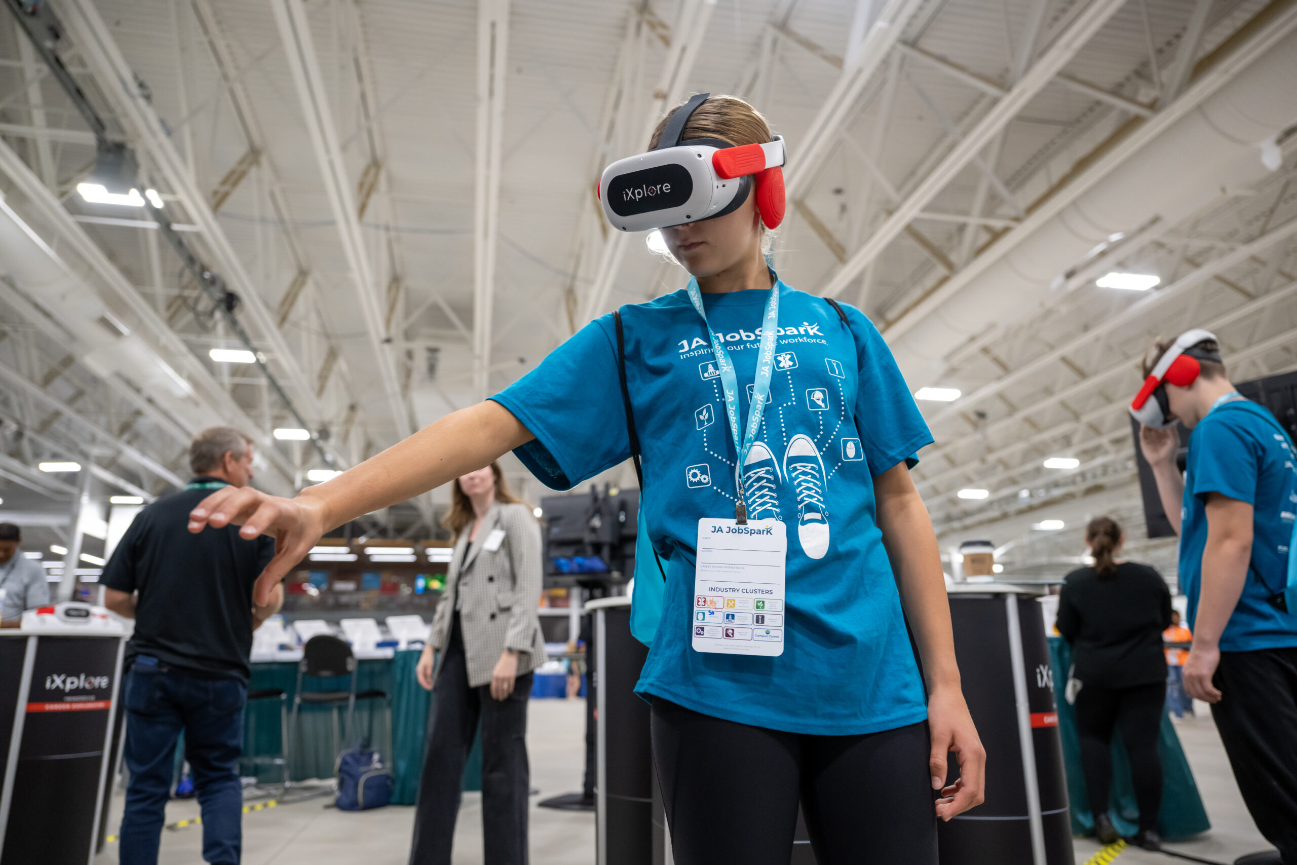 Student wearing VR headset engaging in career exploration environment.