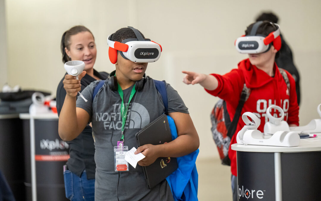 Students wearing VR headset engaging in career exploration environment.